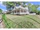 Charming home featuring a welcoming front porch and a well-maintained landscaped yard at 531 Walnut St, Statesville, NC 28677