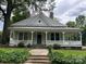 Charming home featuring a large, inviting front porch and well-maintained landscaping at 531 Walnut St, Statesville, NC 28677