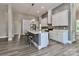 Beautiful kitchen with a large island, white cabinets, and modern stainless appliances at 531 Walnut St, Statesville, NC 28677