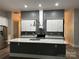 Contemporary kitchen featuring a large island, sleek countertops, and modern appliances at 531 Walnut St, Statesville, NC 28677