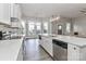 Modern kitchen boasting white countertops and stainless steel appliances with backyard views at 531 Walnut St, Statesville, NC 28677