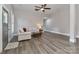 Spacious living room with neutral tones, wood-look flooring, and ample natural light at 531 Walnut St, Statesville, NC 28677