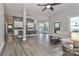 Open-concept living space with neutral tones, modern lighting, and wood-look flooring at 531 Walnut St, Statesville, NC 28677