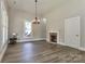 Spacious living room with high ceilings, wood floors, fireplace, and natural light at 531 Walnut St, Statesville, NC 28677