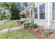 Charming front porch features traditional railings, flowers, and shade trees at 531 Walnut St, Statesville, NC 28677