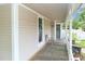 Inviting front porch with ample space for relaxing and enjoying the neighborhood views at 531 Walnut St, Statesville, NC 28677