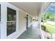 Inviting front porch with ample space for relaxing and enjoying the neighborhood views at 531 Walnut St, Statesville, NC 28677