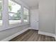 Bright sunroom features large windows, hardwood floors, and neutral paint at 531 Walnut St, Statesville, NC 28677
