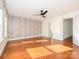 Spacious bedroom featuring an accent wall, hardwood floors, and great natural light at 541 Jetton St, Davidson, NC 28036
