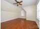 A bedroom featuring hardwood floors, a modern ceiling fan, and bright natural light at 541 Jetton St, Davidson, NC 28036