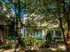 Charming two-story home featuring a quaint front yard and inviting porch with a bright teal front door at 541 Jetton St, Davidson, NC 28036