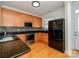 Updated kitchen showcasing stainless steel appliances, granite counters, and hardwood floors at 541 Jetton St, Davidson, NC 28036