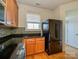 Well-lit kitchen features hardwood floors, granite counters and modern appliances at 541 Jetton St, Davidson, NC 28036
