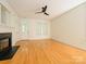Well-lit living room with hardwood floors, fireplace, and neutral wall color at 541 Jetton St, Davidson, NC 28036