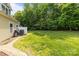 Expansive backyard featuring a lush green lawn and mature trees, perfect for outdoor activities and relaxation at 5621 Tipperlinn Way, Charlotte, NC 28278