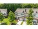 Beautifully designed two-story home with a stone and siding facade, complemented by a well-manicured lawn at 5621 Tipperlinn Way, Charlotte, NC 28278