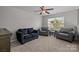 Upstairs living room featuring comfortable seating area and natural light from the window at 5621 Tipperlinn Way, Charlotte, NC 28278