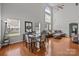 Bright living space featuring tall ceilings, many windows, hardwood floors, and modern furnishings at 5621 Tipperlinn Way, Charlotte, NC 28278