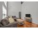 Inviting living room featuring tall ceilings, many windows, hardwood floors, and comfortable seating at 5621 Tipperlinn Way, Charlotte, NC 28278