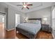 Comfortable main bedroom with hardwood floors, neutral walls, and an attached bathroom at 5621 Tipperlinn Way, Charlotte, NC 28278