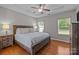 Spacious main bedroom features a tray ceiling, hardwood floors, and lots of natural light at 5621 Tipperlinn Way, Charlotte, NC 28278