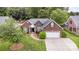 Brick house features a manicured lawn and attached two-car garage at 5706 Sustar Dr, Monroe, NC 28110