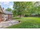 Well-maintained backyard with a patio and lush green lawn at 5706 Sustar Dr, Monroe, NC 28110