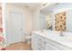 Bright bathroom featuring a double sink vanity, tile flooring, and a floral shower curtain at 5706 Sustar Dr, Monroe, NC 28110