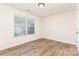 Bright bedroom with hardwood floors and a large window with natural light at 5706 Sustar Dr, Monroe, NC 28110