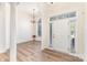 Elegant entryway featuring wood flooring, a chandelier, and an arched doorway at 5706 Sustar Dr, Monroe, NC 28110