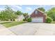 Brick home with two-car garage and long driveway at 5706 Sustar Dr, Monroe, NC 28110
