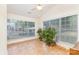 Light filled sunroom with large windows and tile flooring, offering a relaxing space for plants and seating at 5706 Sustar Dr, Monroe, NC 28110