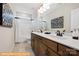 Well-lit bathroom features double sink vanity with modern fixtures and decorative artwork at 6308 Honor Ave, Midland, NC 28107