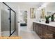 Luxurious bathroom with a glass-enclosed shower, double vanity, and modern fixtures at 6308 Honor Ave, Midland, NC 28107