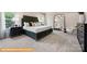 Serene bedroom featuring a large window, neutral decor, and comfortable furnishings at 6308 Honor Ave, Midland, NC 28107