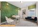 Bright home office featuring modern desk, stylish lighting, and green geometric wallpaper at 6308 Honor Ave, Midland, NC 28107