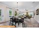 Open living and dining area filled with natural light, modern decor, and stylish furnishings at 6308 Honor Ave, Midland, NC 28107