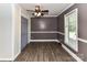 Bedroom with a modern ceiling fan, neutral paint, hardwood floors and a large window at 70 Cumberland Sw Ct, Concord, NC 28025