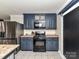 Modern kitchen features stainless steel appliances and stylish cabinetry at 70 Cumberland Sw Ct, Concord, NC 28025