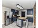A kitchen with stainless steel appliances and a prep island with a marble countertop at 70 Cumberland Sw Ct, Concord, NC 28025