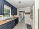 Well-lit kitchen features stainless steel sink, stylish backsplash, and ample counter space at 70 Cumberland Sw Ct, Concord, NC 28025