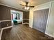 This living room features wood-look flooring and a connecting door to the bedroom at 70 Cumberland Sw Ct, Concord, NC 28025