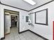 Storage room with tile floor, drop ceiling and access to the laundry area and back yard at 70 Cumberland Sw Ct, Concord, NC 28025