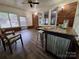 Charming sun room with a rustic bar area, featuring durable flooring and ample natural light at 70 Cumberland Sw Ct, Concord, NC 28025