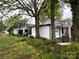 Exterior view features a well-manicured lawn and an attached garage at 713 Sloop Ave, Kannapolis, NC 28083