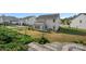 Expansive backyard features an outdoor patio, lush lawn, and a classic black fence, perfect for entertaining at 7332 Newsome Sw Ct, Concord, NC 28025