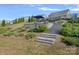 Backyard landscape showcasing lush greenery and tiered levels, ideal for relaxation and outdoor enjoyment at 7332 Newsome Sw Ct, Concord, NC 28025