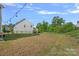 A spacious backyard with a privacy fence, offering plenty of room for outdoor activities and gardening at 7332 Newsome Sw Ct, Concord, NC 28025