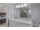 Bathroom featuring double sinks, granite countertops, and a large mirror at 7332 Newsome Sw Ct, Concord, NC 28025