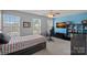 Bedroom featuring lots of natural light, a ceiling fan, and neutral carpeting at 7332 Newsome Sw Ct, Concord, NC 28025